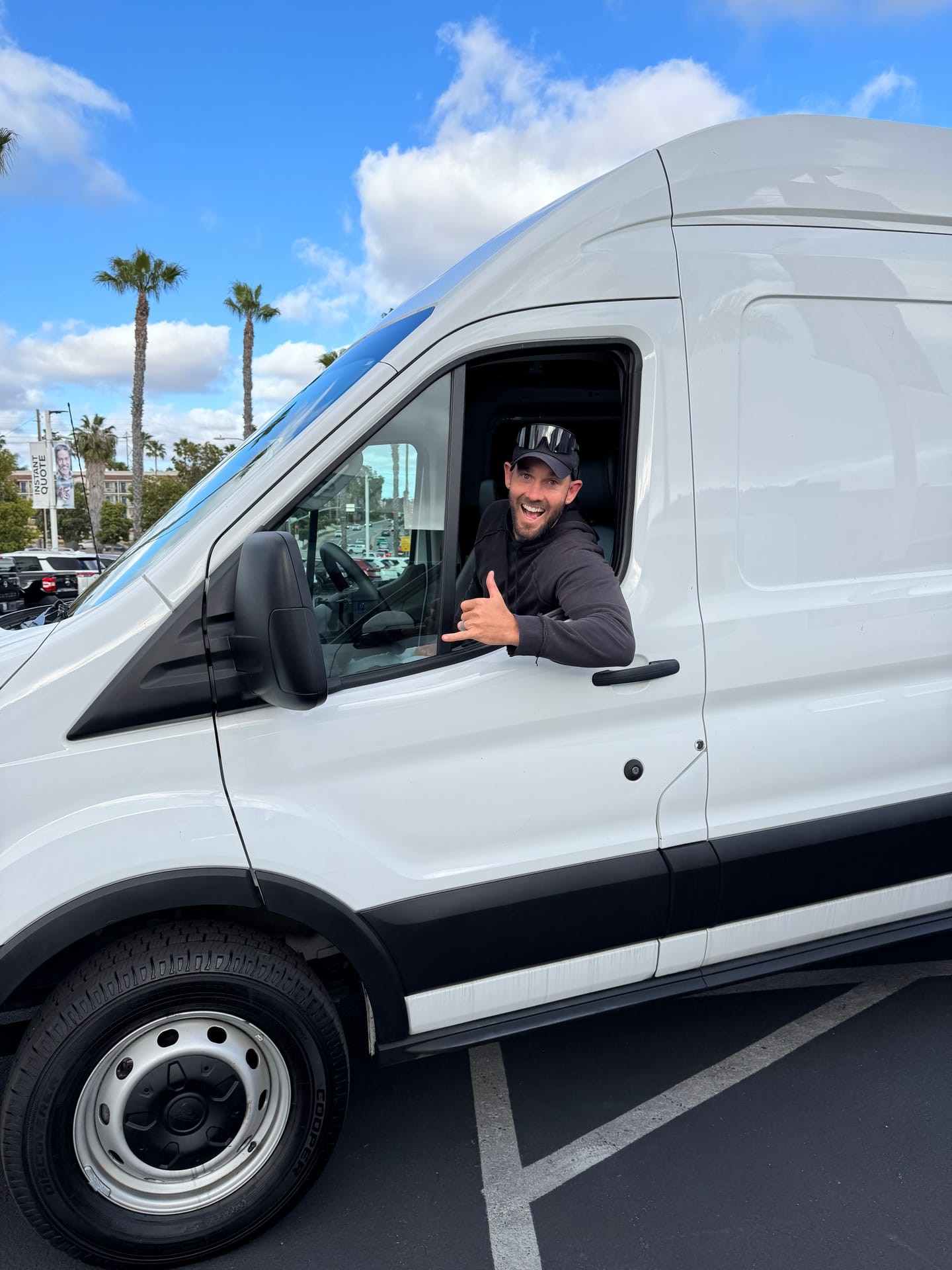 Andrew Underhill, founder of Emery Custom Builds, behind the wheel of a Ford Transit